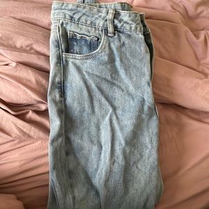 Flare and wide legged jeans with a moon and sun on back pockets!